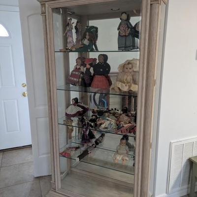 Display cabinet with part of doll collection.