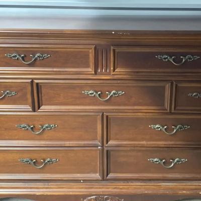 Classic Brown Wooden Dresser with Ornate Trim