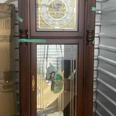 Howard Miller Brown Wood Grandfather Clock with Pendulum and Weights