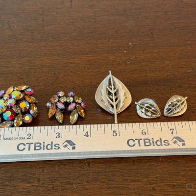 Two vintage brooches with matching clip on earrings