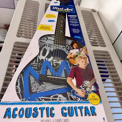 First Act Discovery 30-inch acoustic guitar with a graffiti design