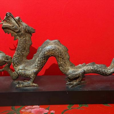Chinese bronze dragon statue holding a flaming pearl