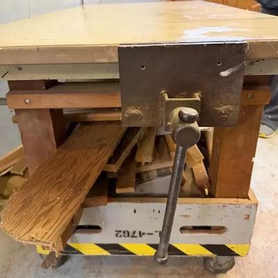Work Table with Wheels, Electrical Plugins, Vise, & Scrap Wood