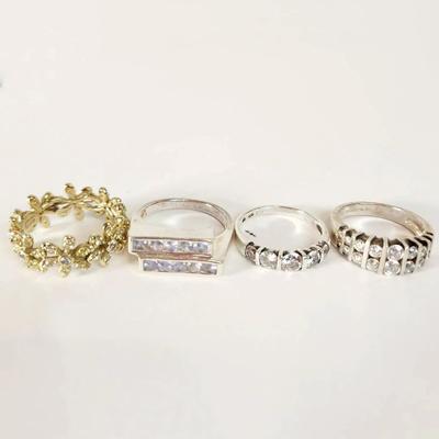 Four Assorted Rings - Yellow Tone Leaf Motif and Sterling Silver Bands