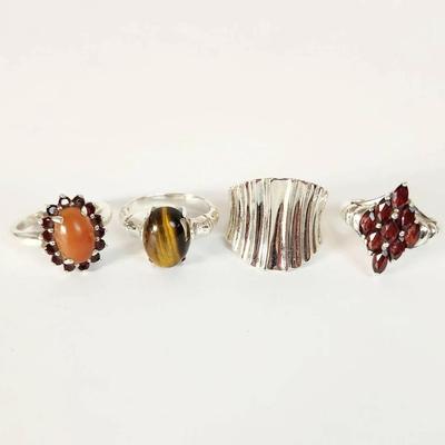 Lot of Four (4) Sterling Silver Gemstone Rings: Tiger's Eye, Garnet, and Modernist Design