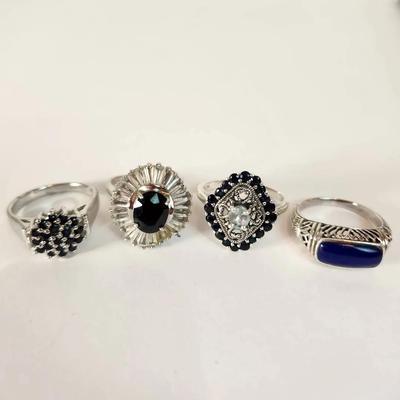 Lot of Four Sterling Silver and Blue Stone Rings