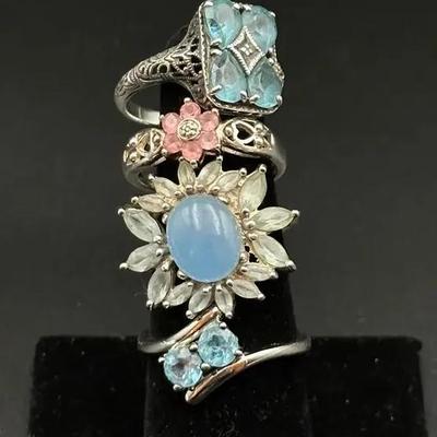 Four 925 Sterling Silver Rings w/ Mixed Stone & Floral Designs – Sizes 7.5–9