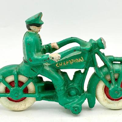 cast-iron Champion toy motorcycle with a police rider