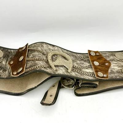 vintage Western-style cowhide belt with a silver-plated horseshoe buckle and coin decoration