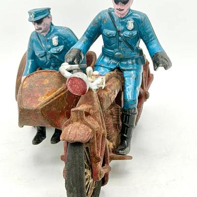 vintage Hubley cast iron police motorcycle with a sidecar and two police officer riders