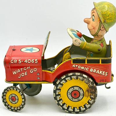 vintage tin lithographed G.I. Joe and His Jouncing Jeep wind-up toy