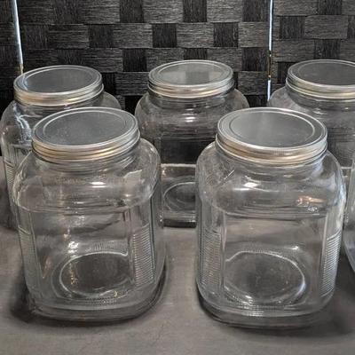 Anchor Hocking 1-gallon glass cracker jar with a metal lid, also known as a Hoosier-style jar. 