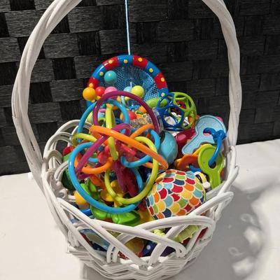 Basket Full Of Teething Rings and Rattles 