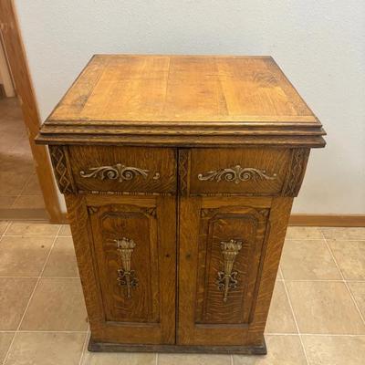 Antique New Home Treadle Sewing Machine Housed In Oak Cabinet