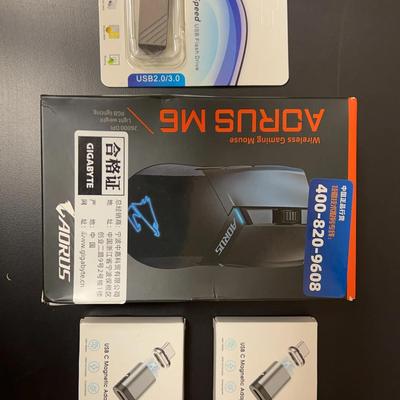 Lot 306: Gaming Mouse, Magnetic Charging Adapter, Memory Stick  