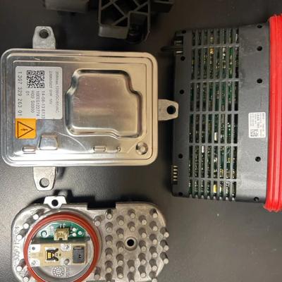 Lot 326: BMW Headlight Electronics Lot – TMS Module, HID Ballast, LED Driver & Housing Piece  This l