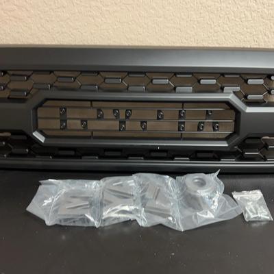 Lot 325: Aftermarket Toyota-Style Front Grille (No Marker Lights)  Aftermarket Toyota-style front gr