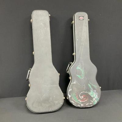 Two Ca. SKB Locking Guitar Cases