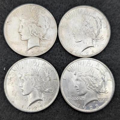Four 1923 Peace Dollars