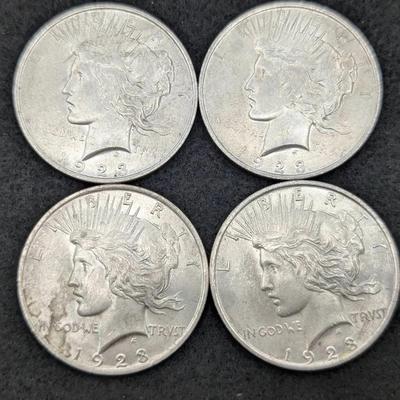 Four 1923 Peace Dollars