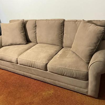 Tan Three-Cushion Sofa with Matching Back Pillows