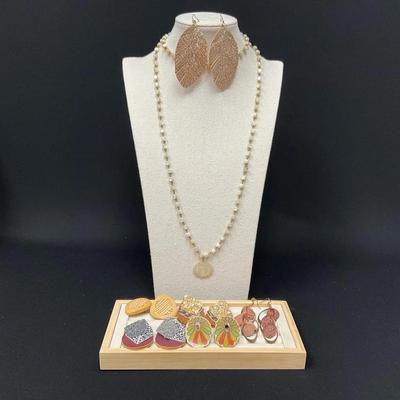 Various Earrings And A Necklace