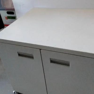 Vintage white heavy duty cabinet on castors.