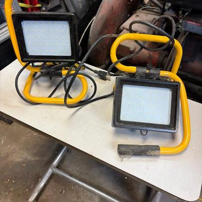 portable LED work lights, also known as floodlights, used for illuminating workspaces
