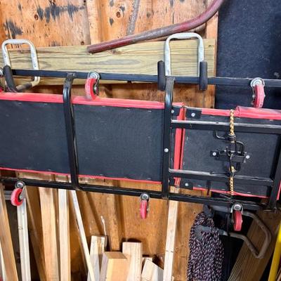 mechanics' rolling creeper, a piece of garage or shop equipment used to work underneath vehicles