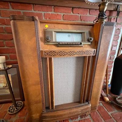 An antique floor-model radio, likely manufactured in the late 1930s for Sears, Roebuck & Co. 
