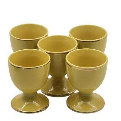 Sale Photo Thumbnail #73: Lot 110   
Yellow Ceramic Egg Cups With Gold Trim, Set of Five (5)