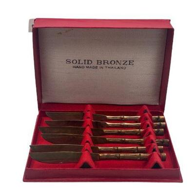 Sale Photo Thumbnail #87: Lot 146   
Solid Bronze Dinner Knives, Bamboo Handles, Set of Six (6)