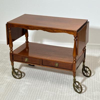 Antique Wood Bar Cart | Of nicely figured wood with a gloss finish, having two lower drawers with brass pulls, with flip up leaves on...