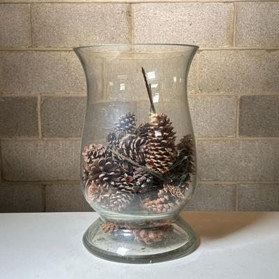 Extra Large Glass Votive | Heavy glass hurricane-shaped vase filled with pinecones Dimensions: h. 16 x dia. 10 in (top diameter)
