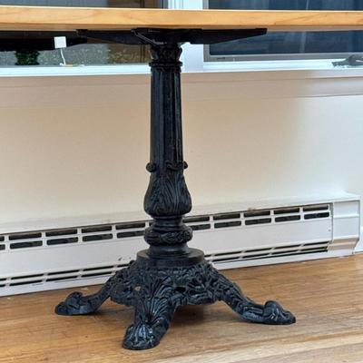 Cast Iron Table Base | With a later wood top attached; overall size of table h. 28.75 x 55 in. Dimensions: h. 27 x w. 17 in (base only,...
