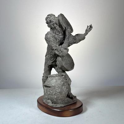 "Petro Enko" Studio Pottery Figure | A signed pottery figure depicting a man with bowls and a jar, signed at the bottom...