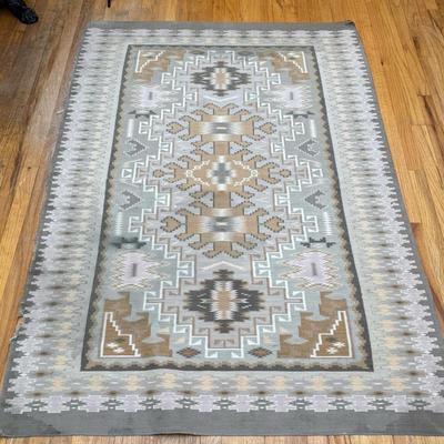 Southwest Flat Woven Rug | Featuring a soft, muted palette of taupe, sage, cream, and gray arranged in a traditional geometric medallion...