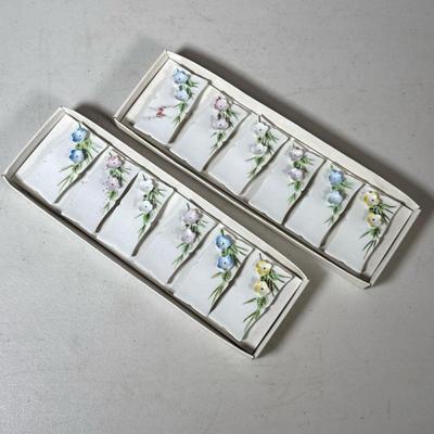 (12pc) Porcelain Place Cards | With raised delicate blue, pink, white and yellow flowers; made in Japan Dimensions: h. 1 x w. 2.5 x d. .5...