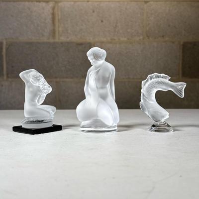 (3pc) Lalique France Frosted Glass Figurines | Frosted (satine) glass figures, including a woman with swan, a fish, and a mermaid on a...