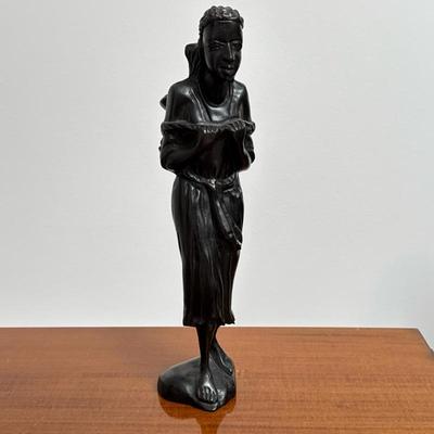 African Carved Wood Figure | Carrying a basket or jar Dimensions: h. 12 x l. 4.25 in
