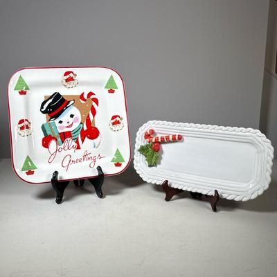 (2pc) Christmas Serving Dishes | Small oblong white dish with raised ceramic candy cane and holly and a square serving plate with snowman...