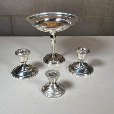 (4pc) Misc. Sterling Weighted Objects | Including three weighted candle stick holders (including a pair and a single), and a weighted...