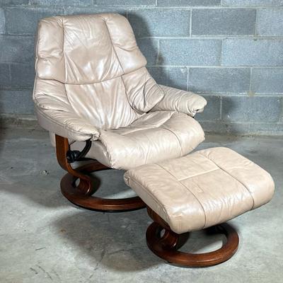 Ekornes Stressless Recliner Chair & Ottoman | Light colored leather chair with circular wood footing and matching footstool. Same...