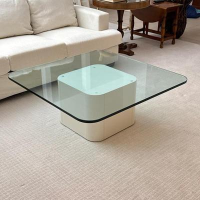 Contemporary Glass Cocktail Table | Postmodern low / coffee table designed as a rounded corner square glass top over a white lacquered...