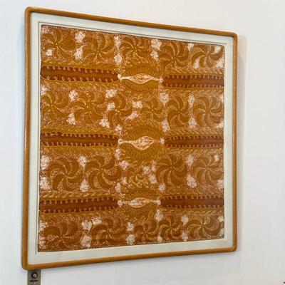 Large Indonesian Batik Textile | A finely patterned batik textile featuring traditional swirling foliate and geometric motifs, matted in...