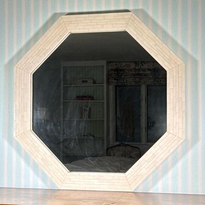 Octagonal Bone mosaic mirror | Having a wide frame inlaid with cream-toned bone tiles Dimensions: h. 42 x w. 42 in
