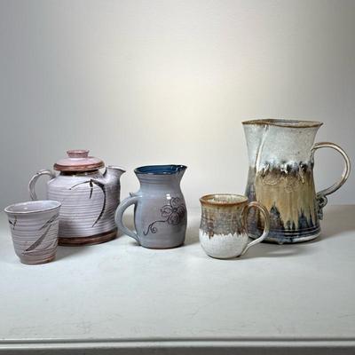 (5pc) Assorted Pottery Lot | Tea pot with matching cup, Small and large pitcher and miscellaneous mug. All signed on bottom. Dimensions:...