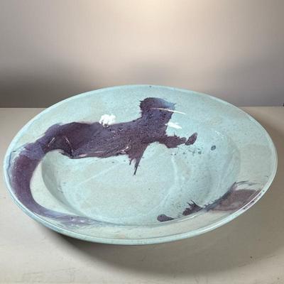 Large Studio Pottery Charger | An oversized art pottery center bowl with flambe purple glaze on a light blue celadon ground; with incised...