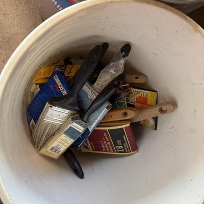 Bucket of paint brushes