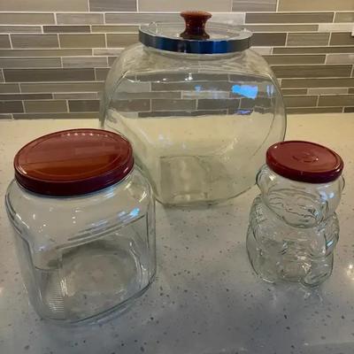 Three Clear Glass Storage Containers with Red Metal Lids